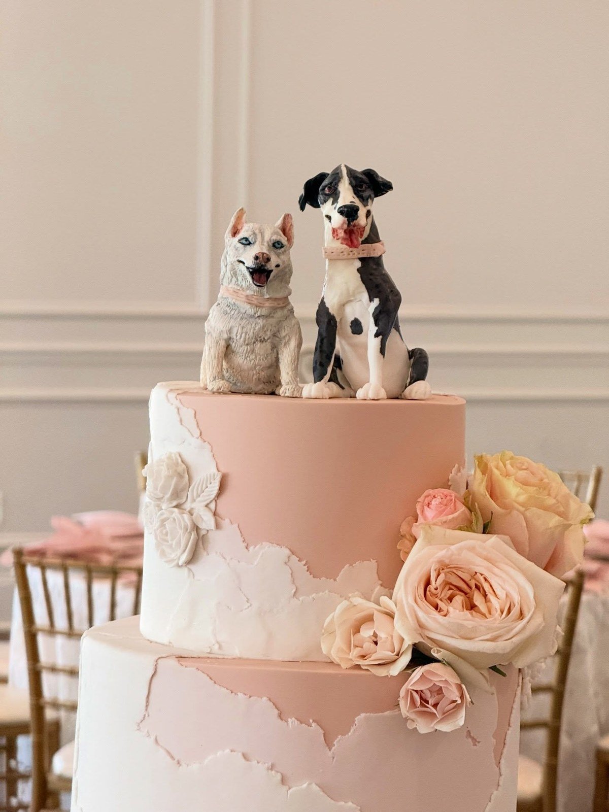 Wedding cake topped with two custom dog figurines