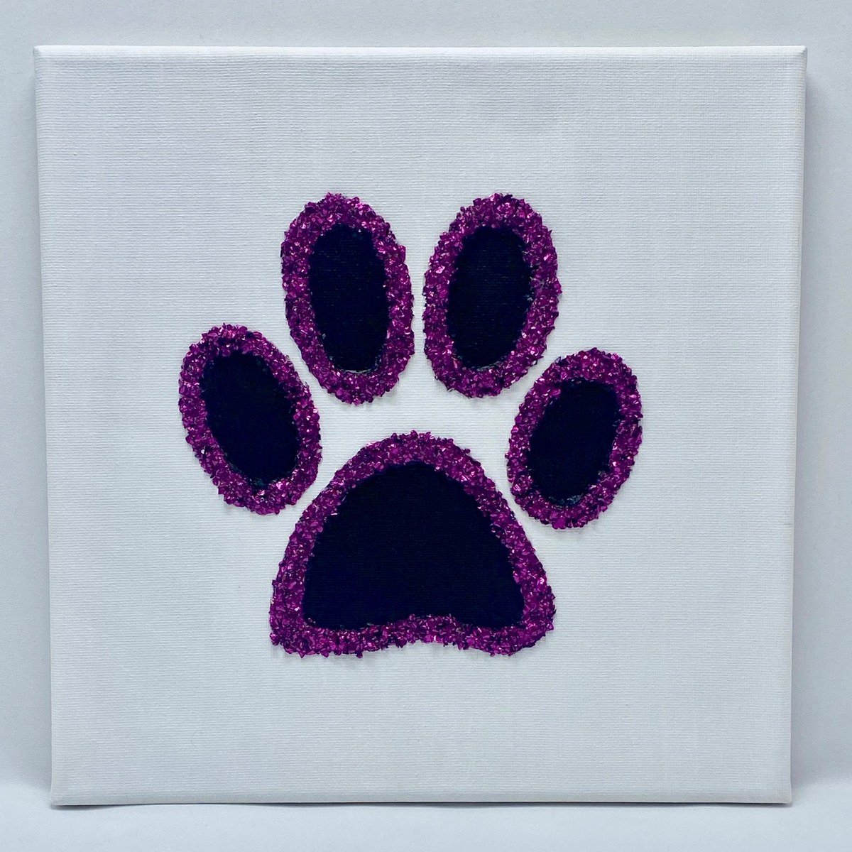 Single paw print (dark purple pads with magenta glitter outline) on a plain white canvas; no readable text